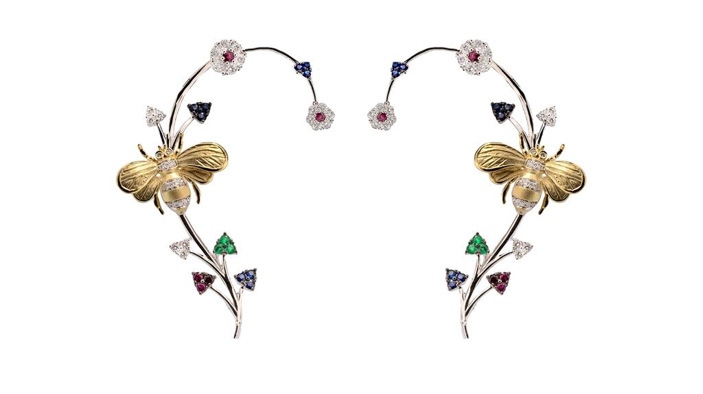 A pair of 18-karat white and yellow gold ear cuffs, featuring a diamond-set bee and flowers made of diamonds, rubies, sapphires and emeralds ($10,560) Simon G. bee ear cuffs